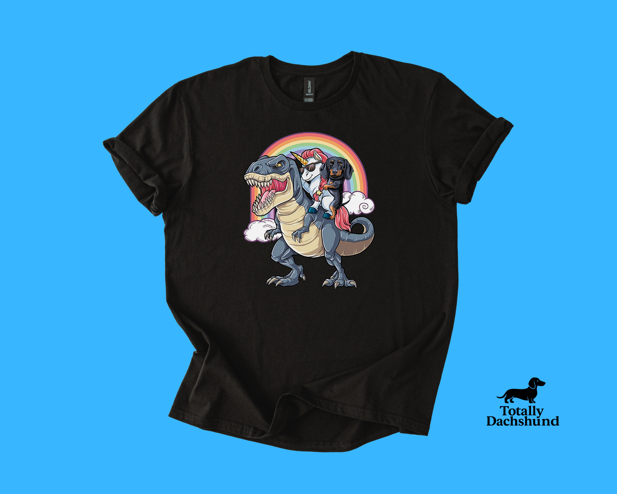 Funny dachshund riding a unicorn with sunglasses on a T-Rex under a rainbow black novelty dog shirt