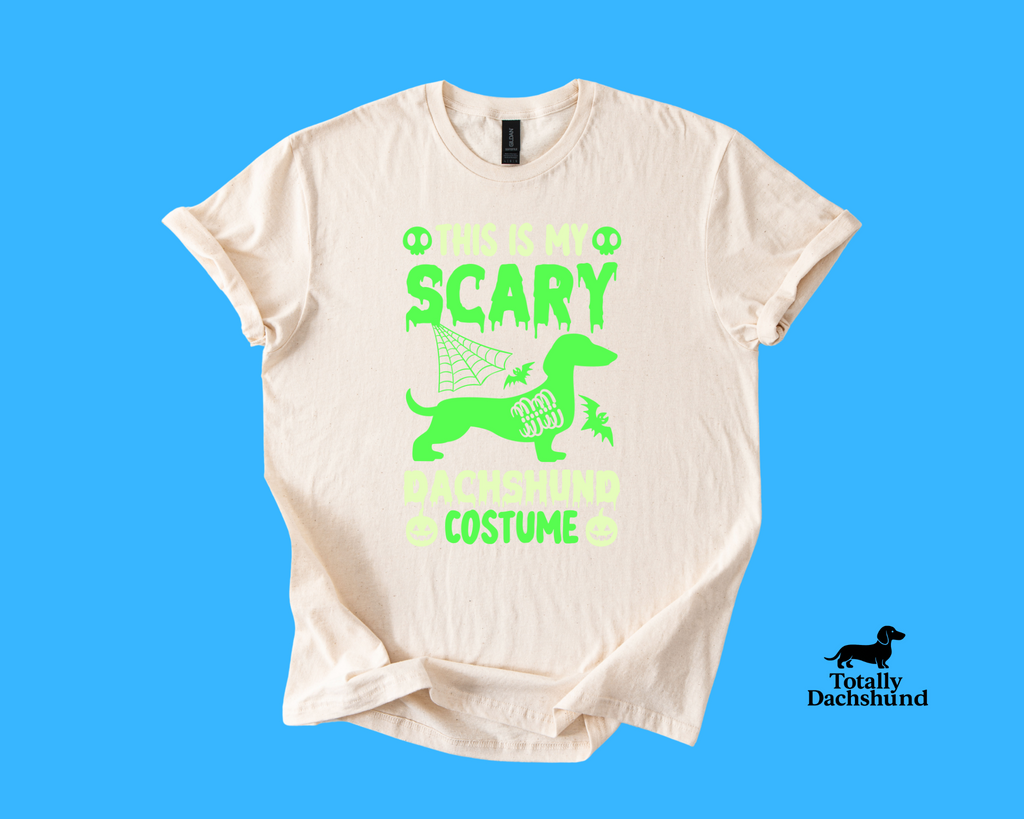white tee with green dachshund and spooky design